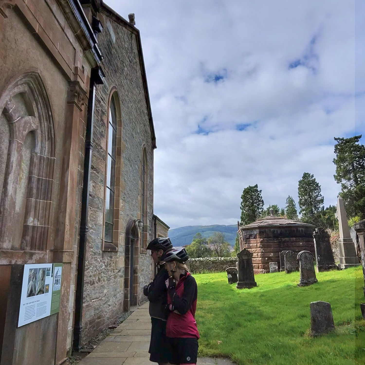 People reading information sign at Historic Kilmun